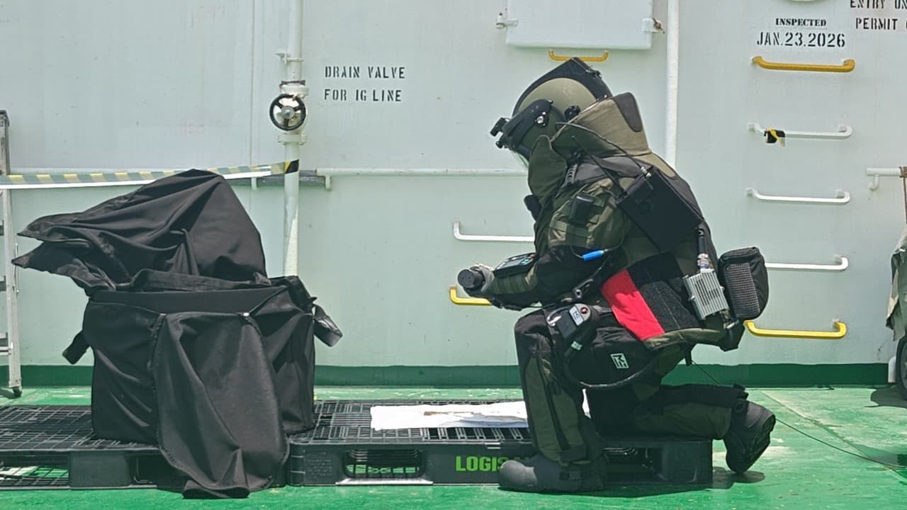 Indian Navy Explosive Ordnance Disposal (EOD) specialists conducting a high-risk recovery operation aboard MT Olympic Life near Kochi port.