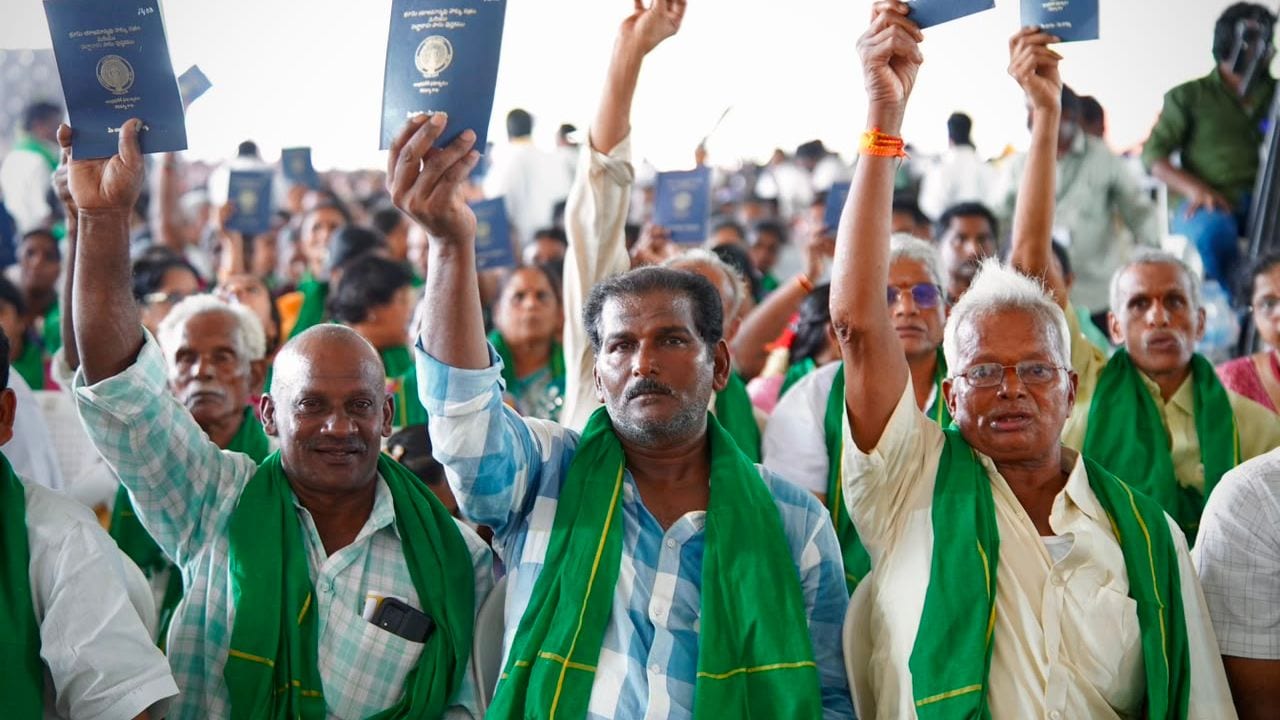 Farmers showing pattadar passbooks